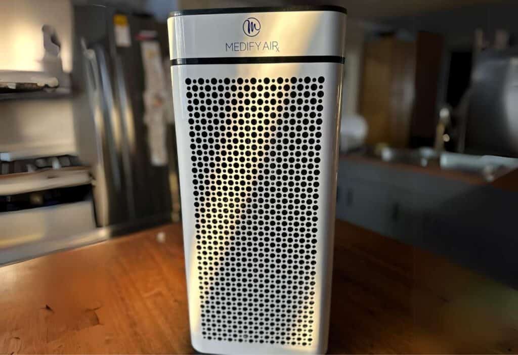 An air purifier sitting on top of a table.