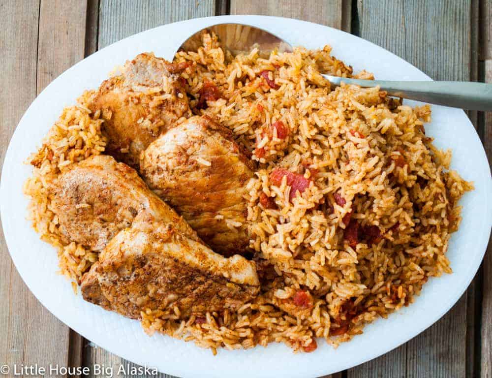 Spanish Rice and pork chops on a platter.