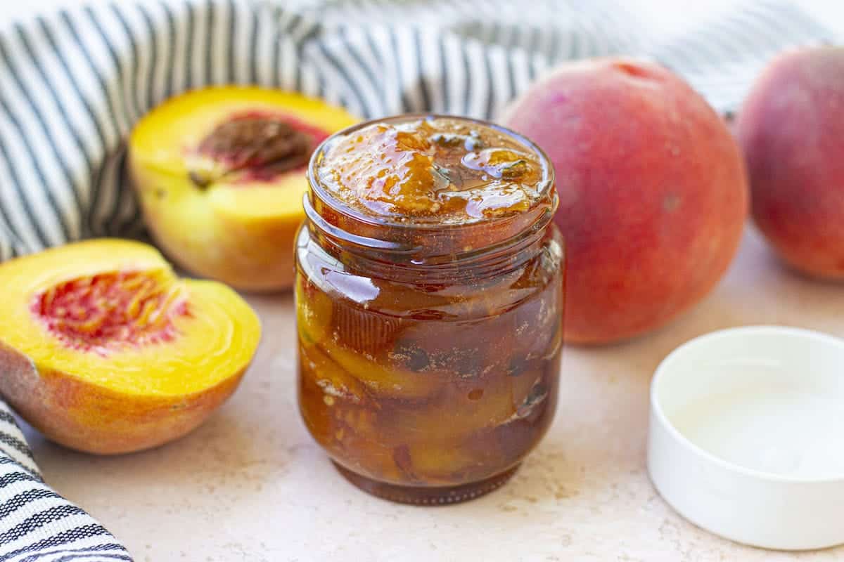 Peach Jalapeno Jam in a mason jar.