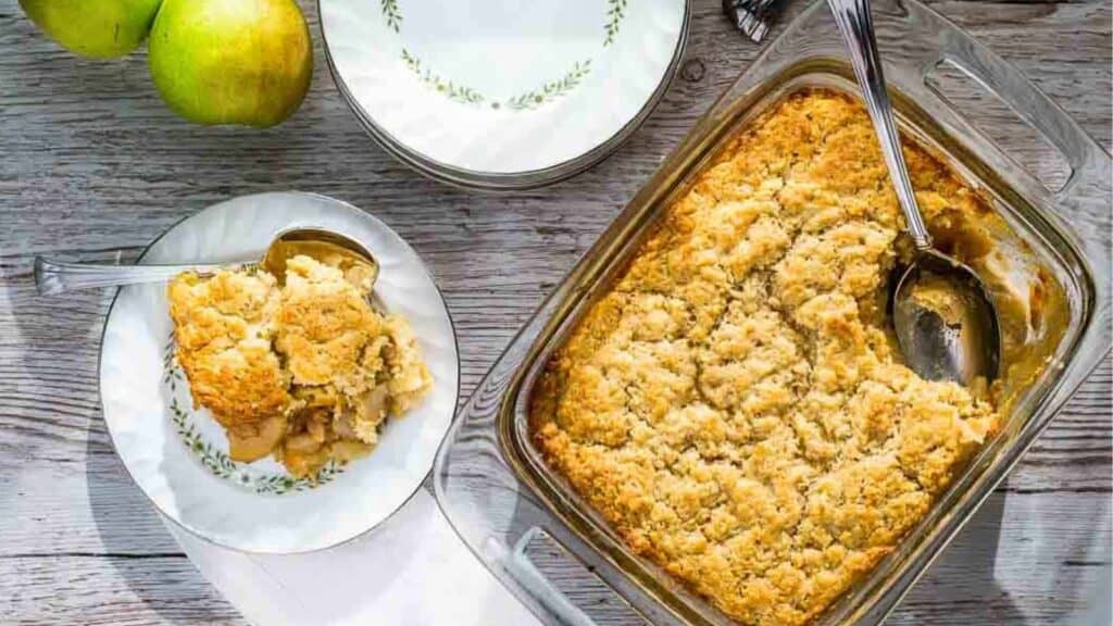 A dish of apple cobbler with apples and pear recipes on it.