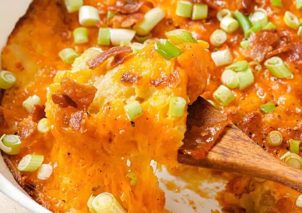 Twice baked potato casserole with bacon and green onions.