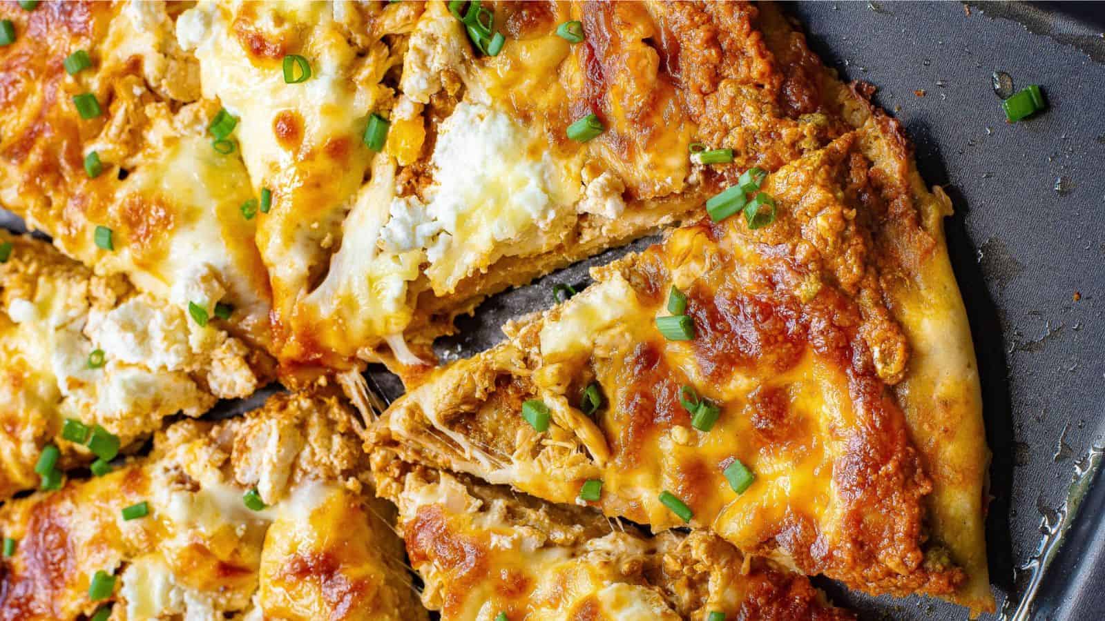 Chicken Pizza loaded with Mozzarella  on a tray.