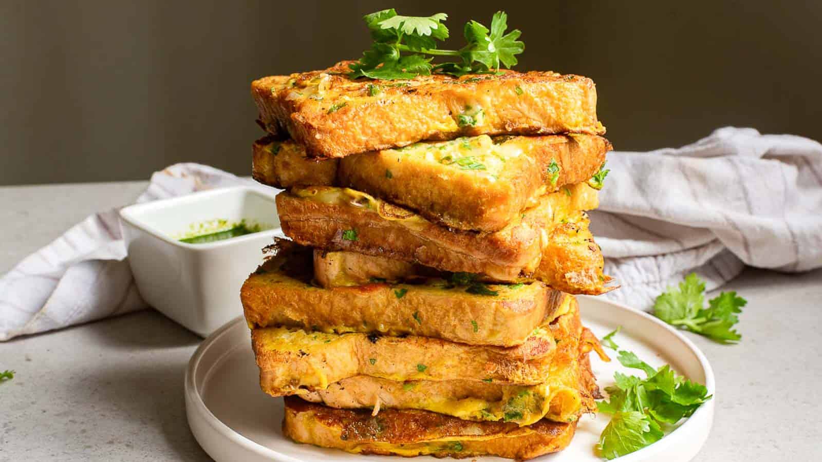A stack of Bombay toast with parsley.