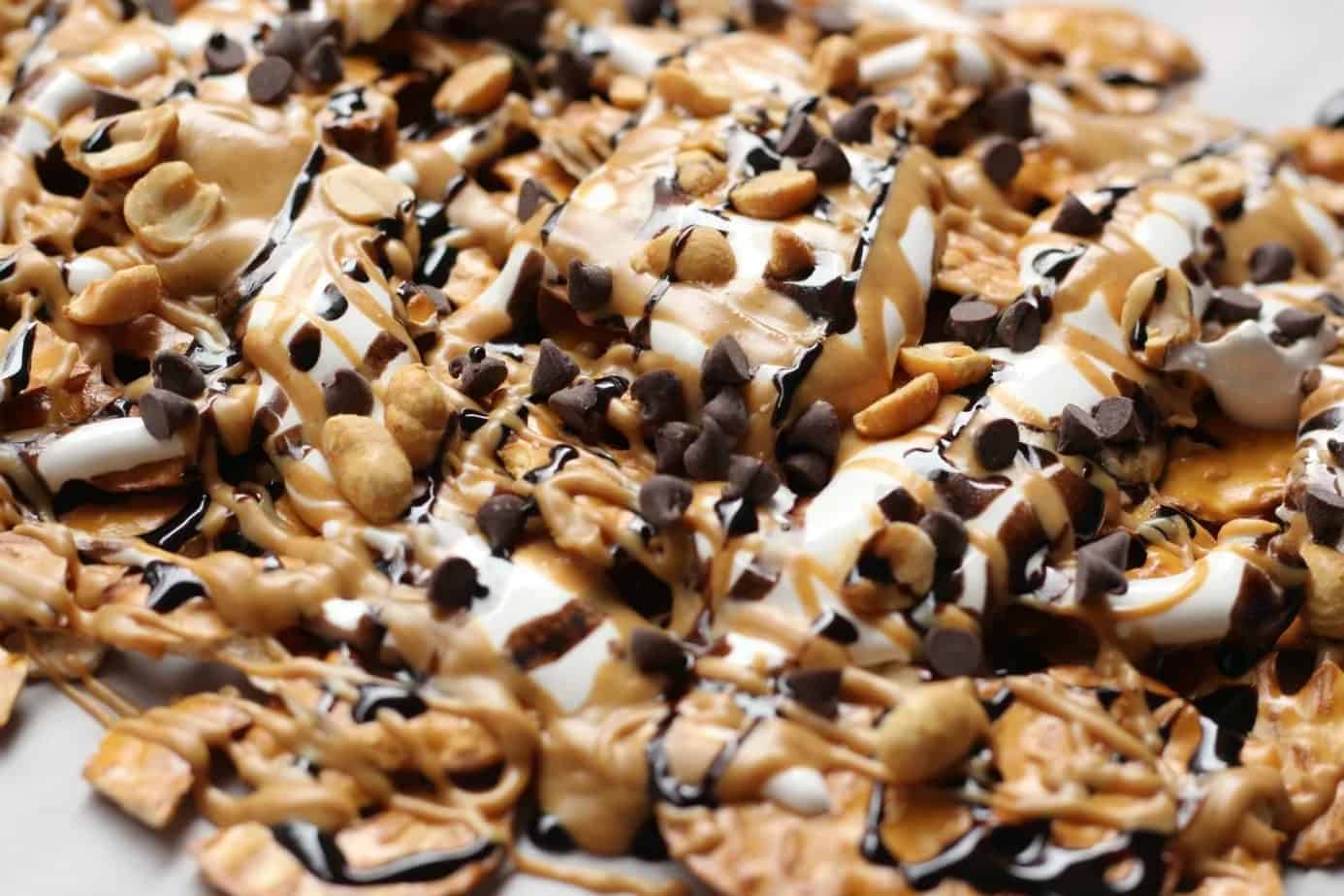 Pan of peanut butter dessert nachos, covered in chocolate, peanut butter, and marshmallow cream.