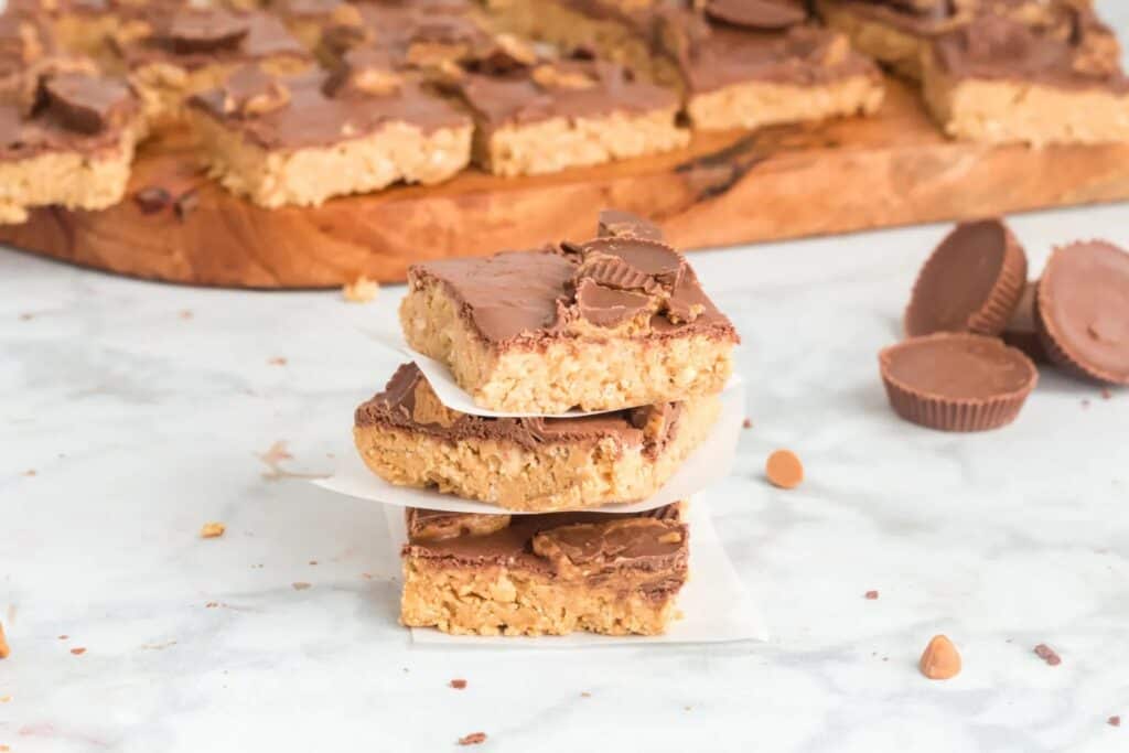 Peanut butter bars stacked on top of each other.