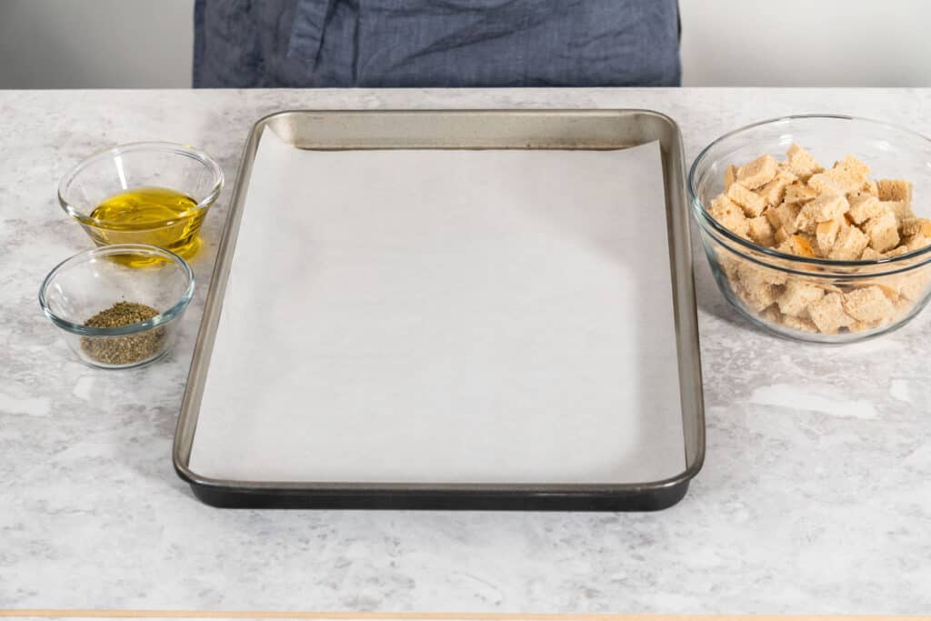 A baking sheet with ingredients on it.