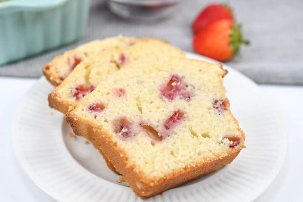 Two slices of strawberry bread on a white plate.