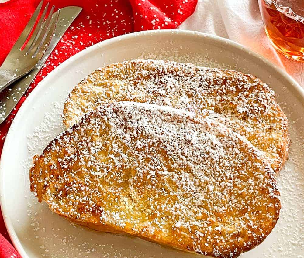 French toast with powdered sugar on a plate is a delicious breakfast option for small households.