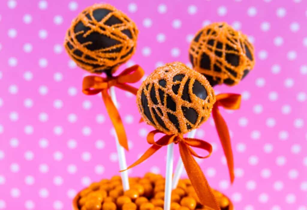 A group of chocolate and orange cake pops.