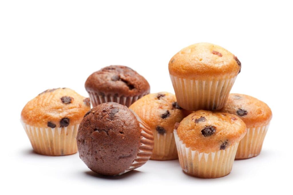 A pile of muffins on a white background.