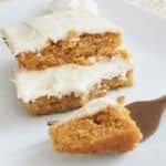 A slice of pumpkin bars on a plate.