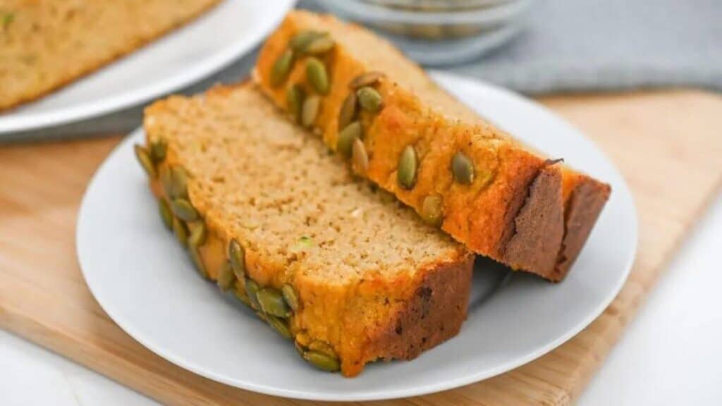 Two slices of zucchini bread on a plate.