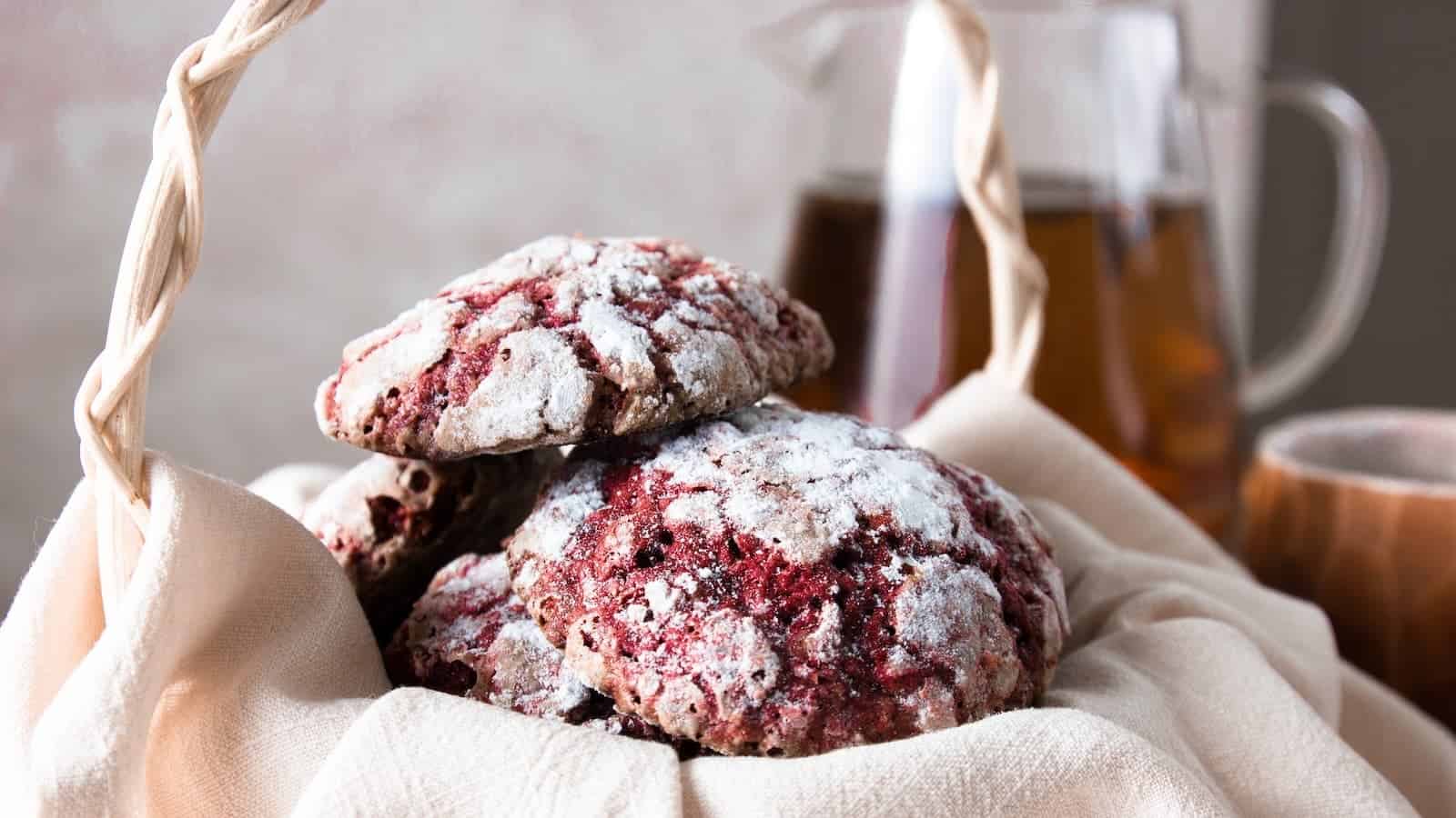 A stack of Valentine red velvet cookies with in a basket.
