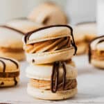 Peanut butter macarons with chocolate drizzle.