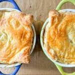 Two pot pies sitting on top of a baking sheet.