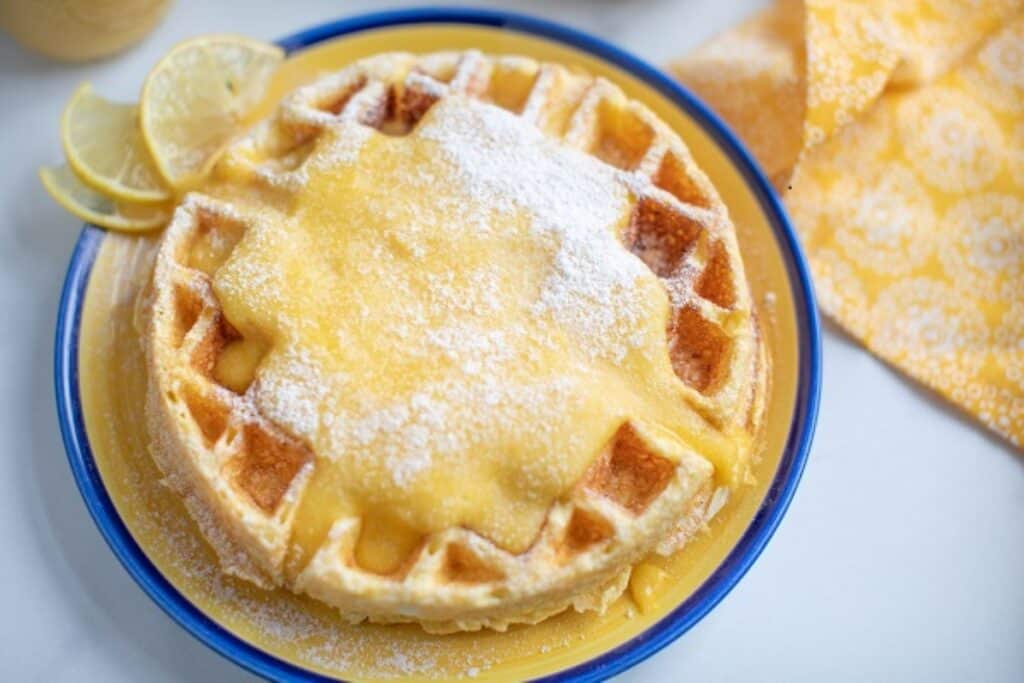 Cream cheese chaffle on a yellow and blue plate.