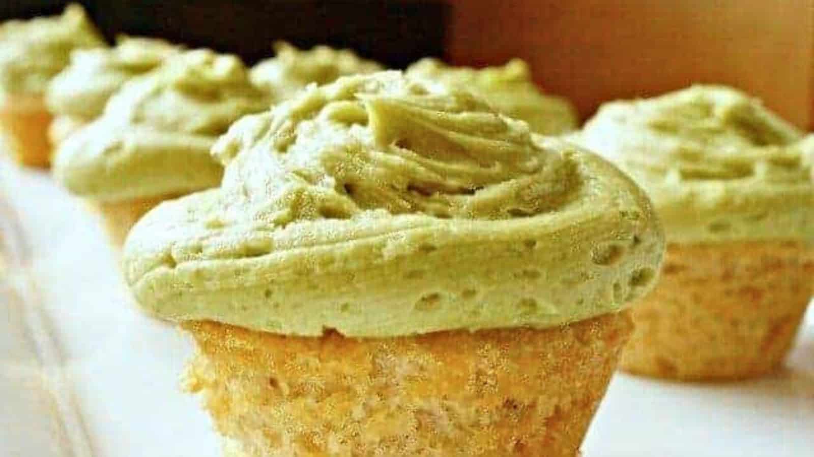 Image shows  Cupcakes with matcha frosting on a white plate.