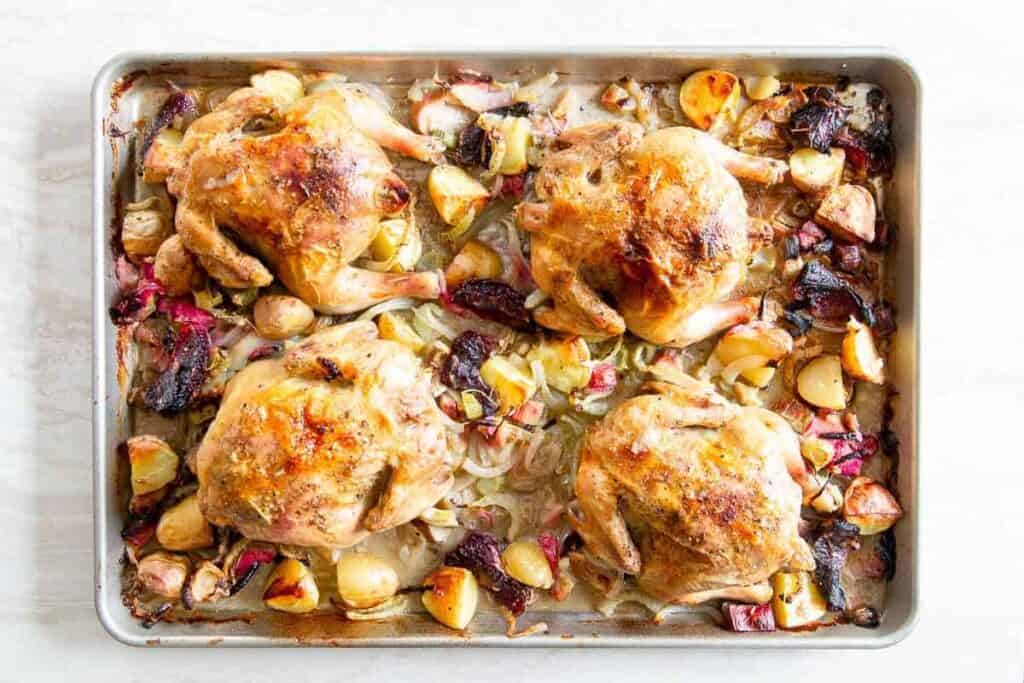 A tray of spring recipes chicken and vegetables.