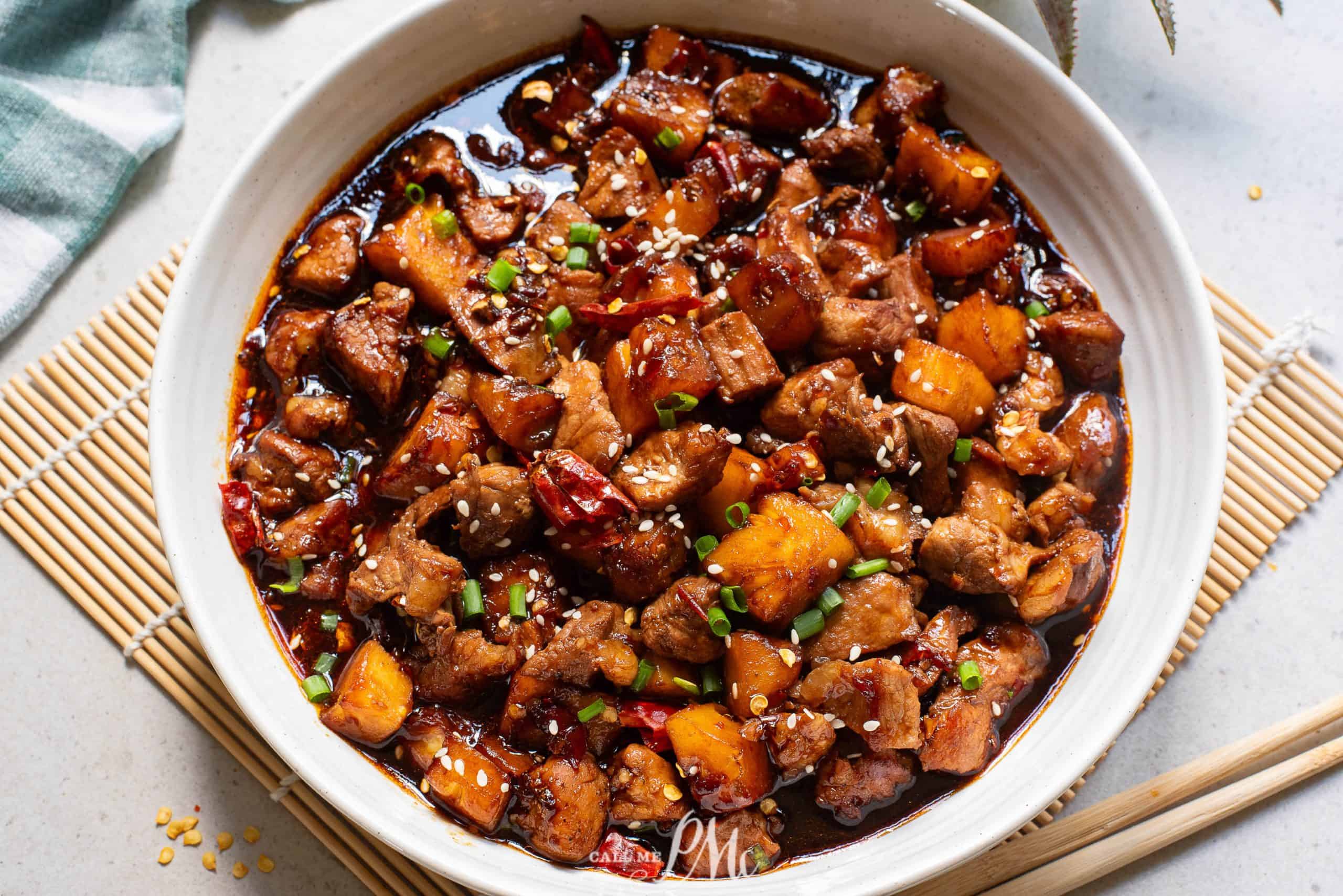 A white bowl with Stovetop Pineapple Pork Tenderloin in it.