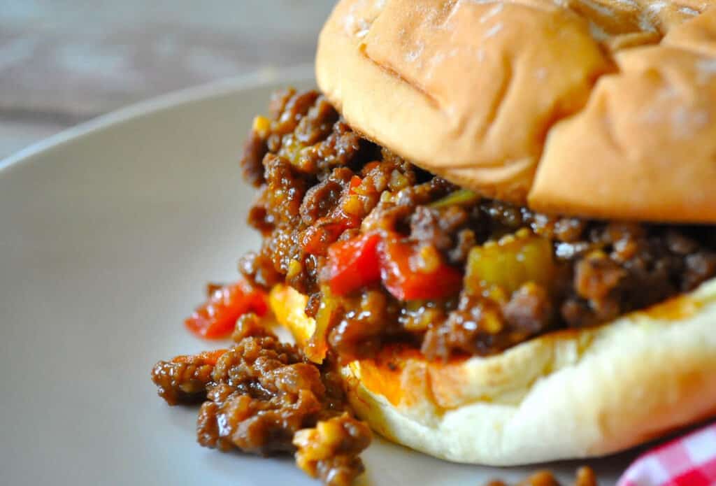 Sloppy joe from the side on a plate.