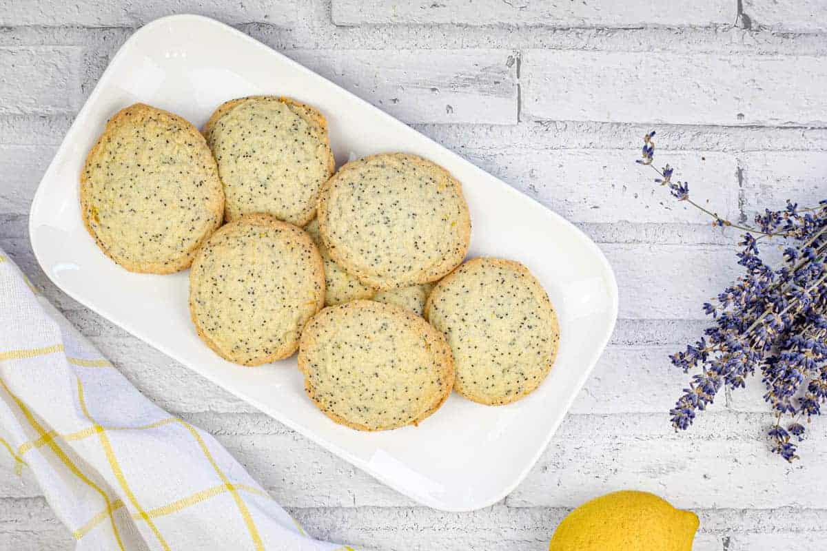 A top-down shot of Lemon Poppy Seed Cookies on a white plate.