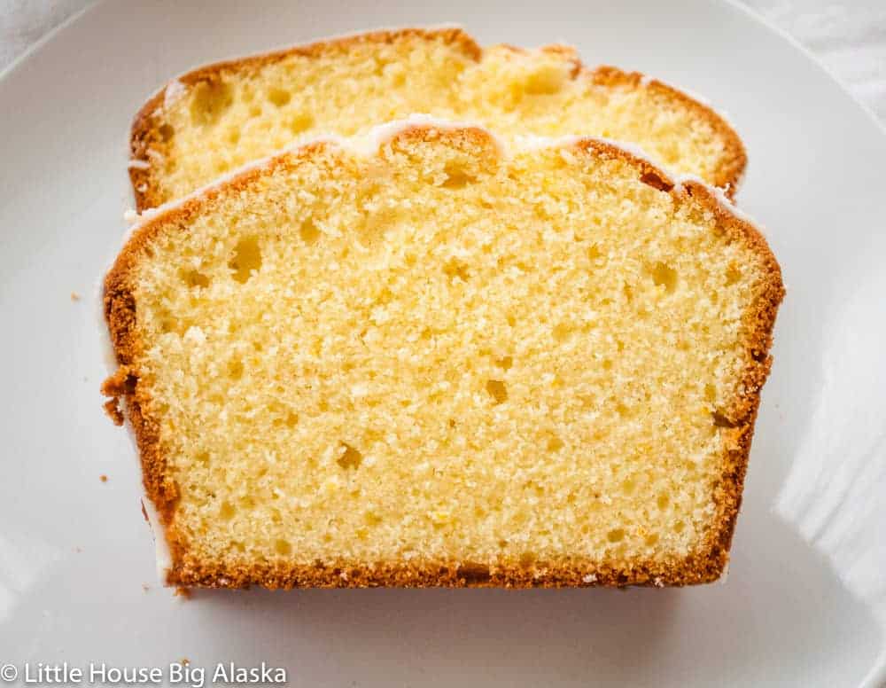 Three slices of pound cake on a white plate.