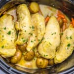 Chicken and vegetables in a slow cooker.