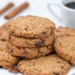 Seed and nut butter cookies on plate served with coffee.