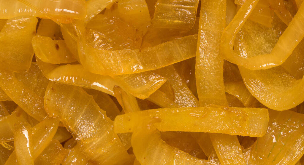 Close-up of translucent, caramelized onions.