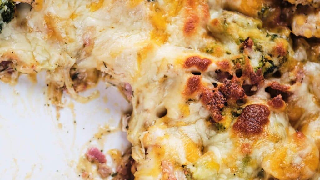 Cheesy chicken bacon ranch casserole in a dish, showing melted cheese and golden-brown crust.