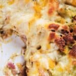 Cheesy chicken bacon ranch casserole in a dish, showing melted cheese and golden-brown crust.