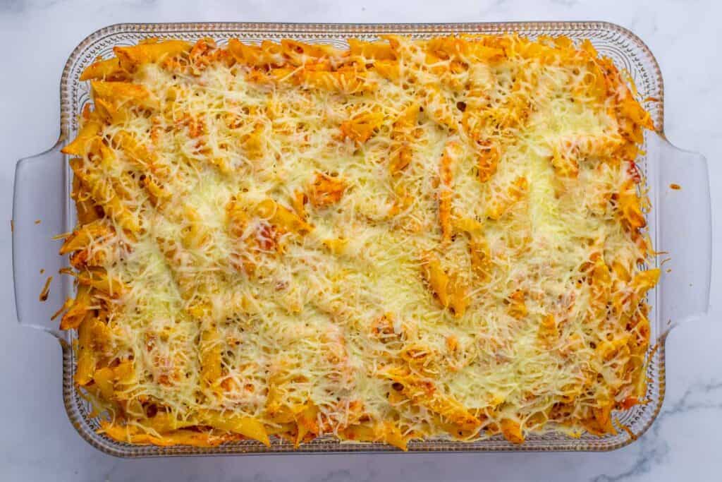 A freshly baked tray of cheesy pasta casserole.