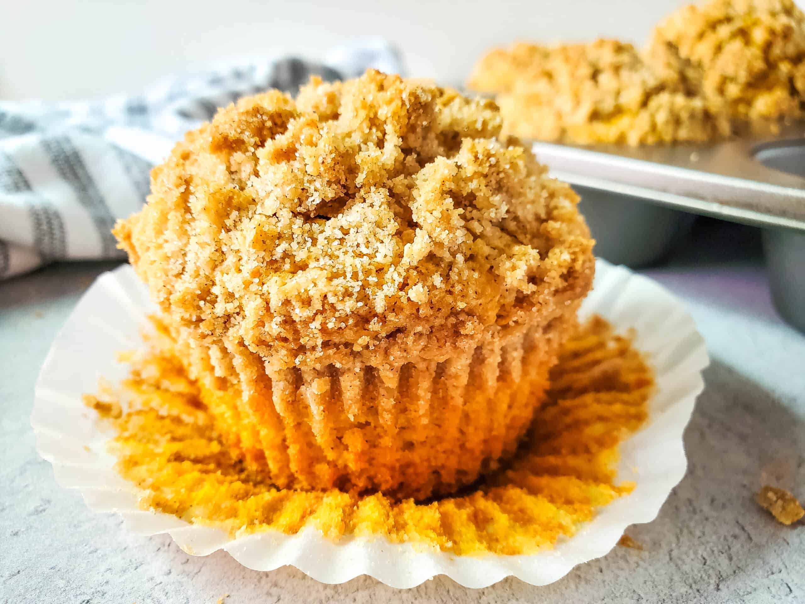 Pumpkin muffin topped with streusel.