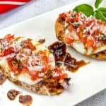 Grilled Bruschetta Chicken on a white plate.