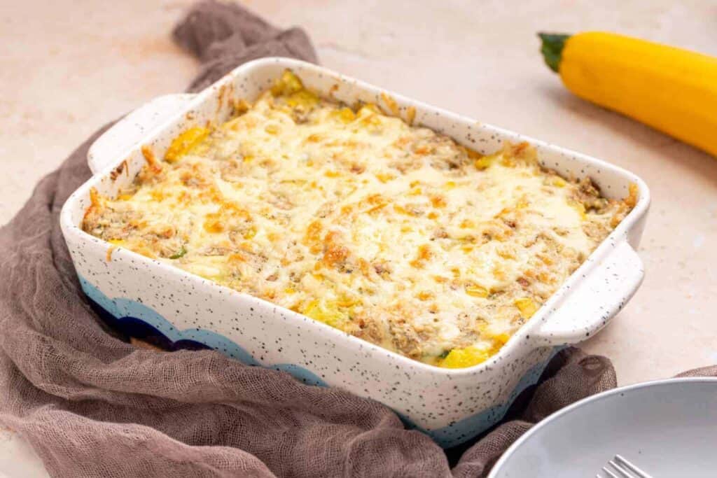 Squash Casserole with Stuffing in a white dish. 