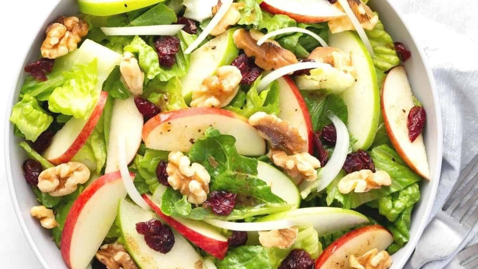 A fresh apple cranberry salad with a bright red and green color.