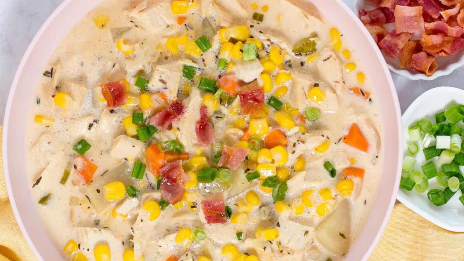 A bowl of creamy crock pot chicken corn soup with a rich, creamy texture.