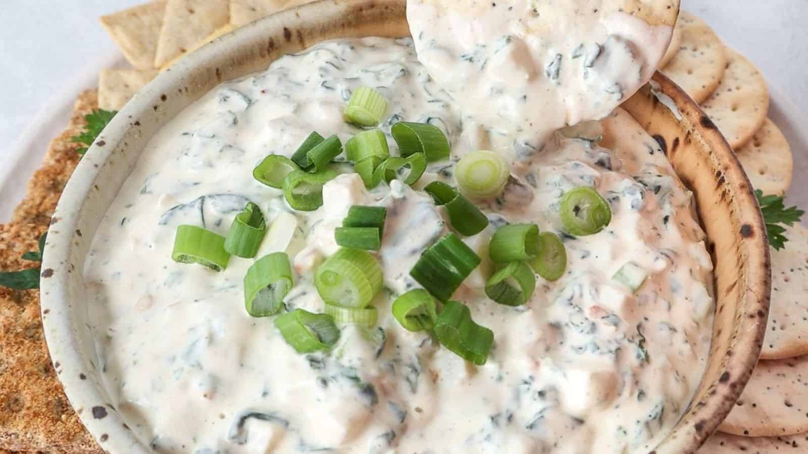 A bowl of Knorr Vegetable Dip with colorful veggies on the side.