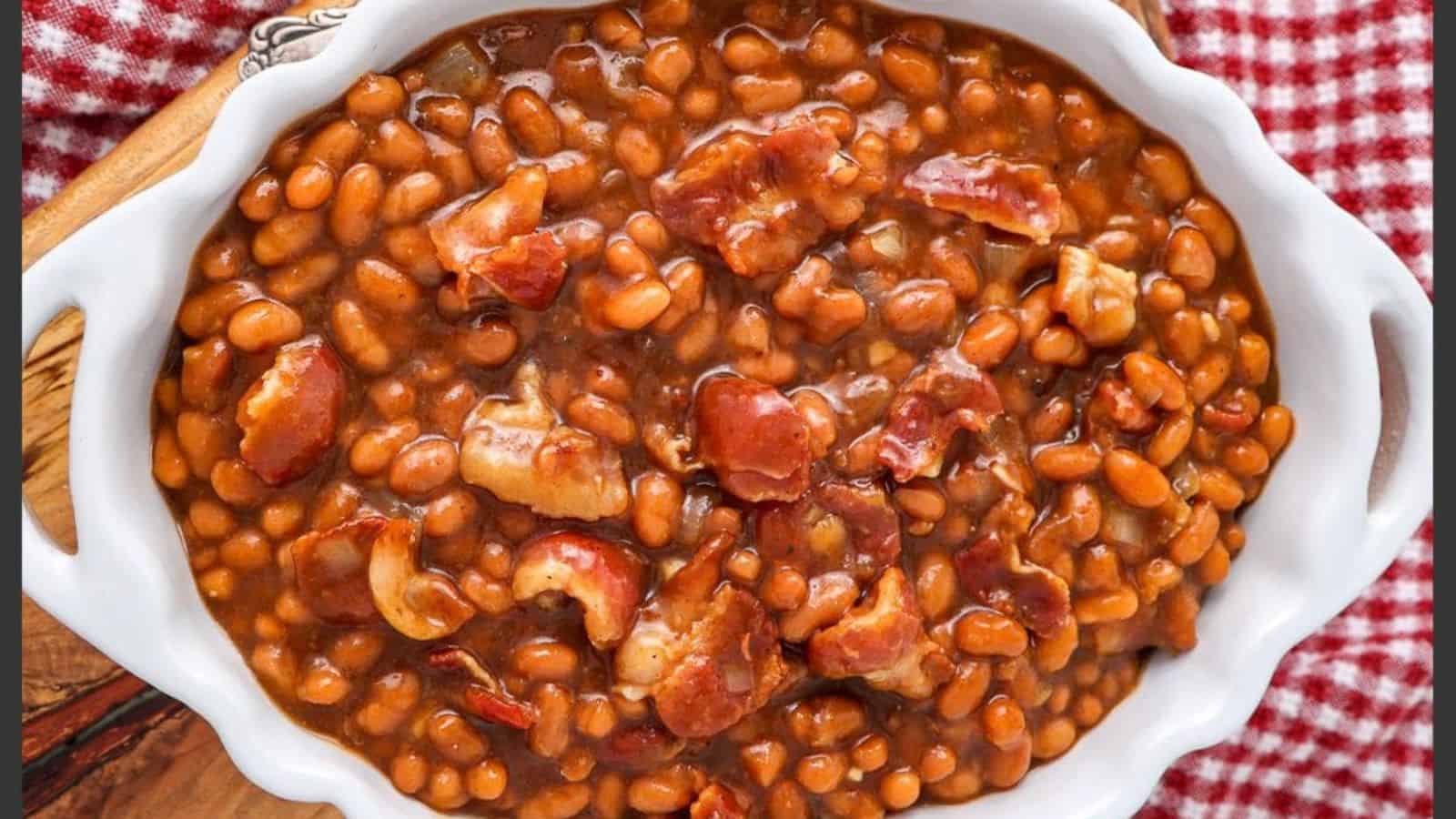 A slow cooker filled with Boston baked beans ready to be served.