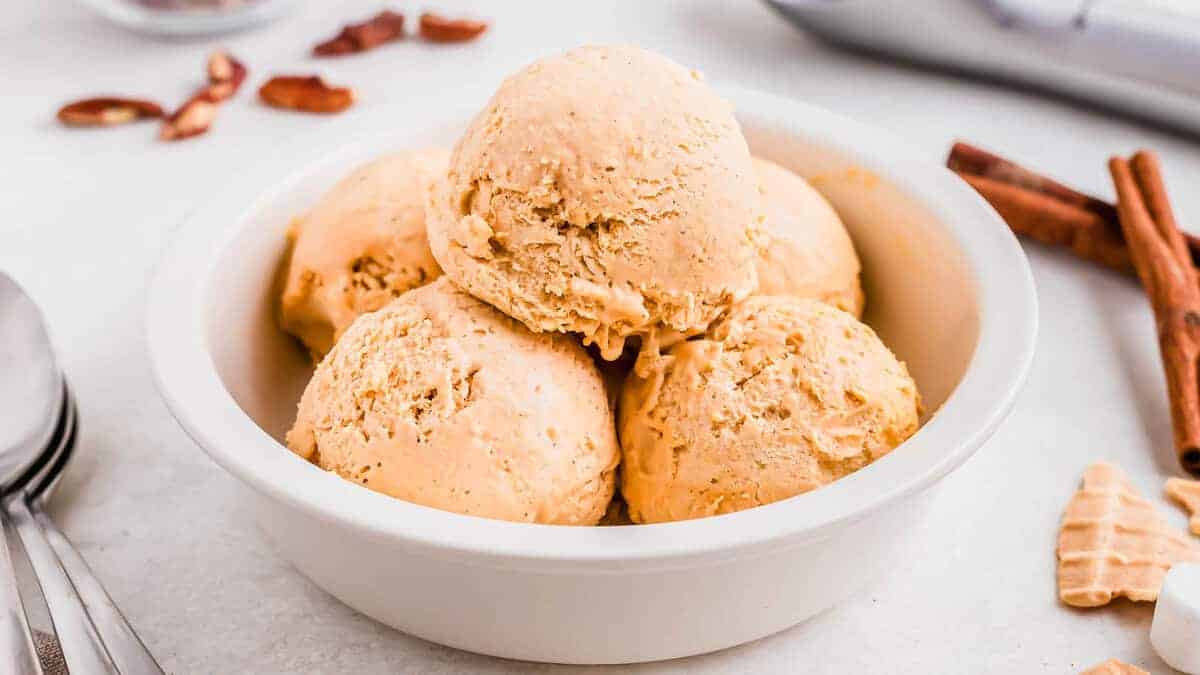 Sweet potato ice cream in a metal bowl with a spoon.