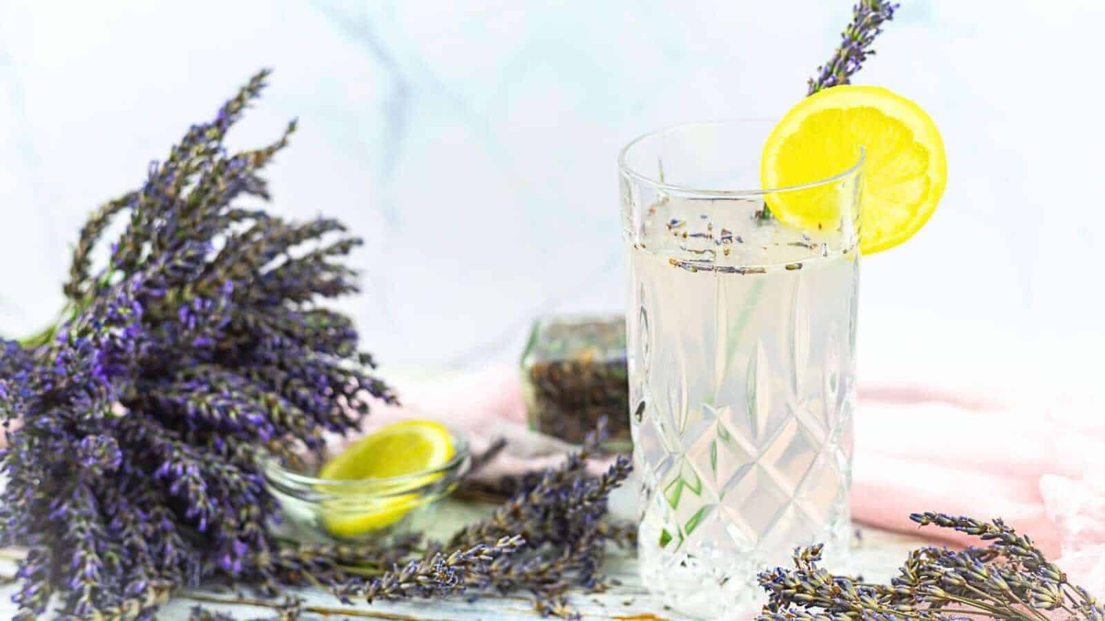 Lemonade garnished with a lemon slice and lavender.