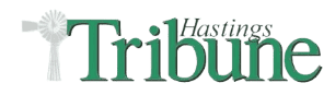 Logo of Hastings Tribune, featuring a green and black font with an abstract windmill design on the left.