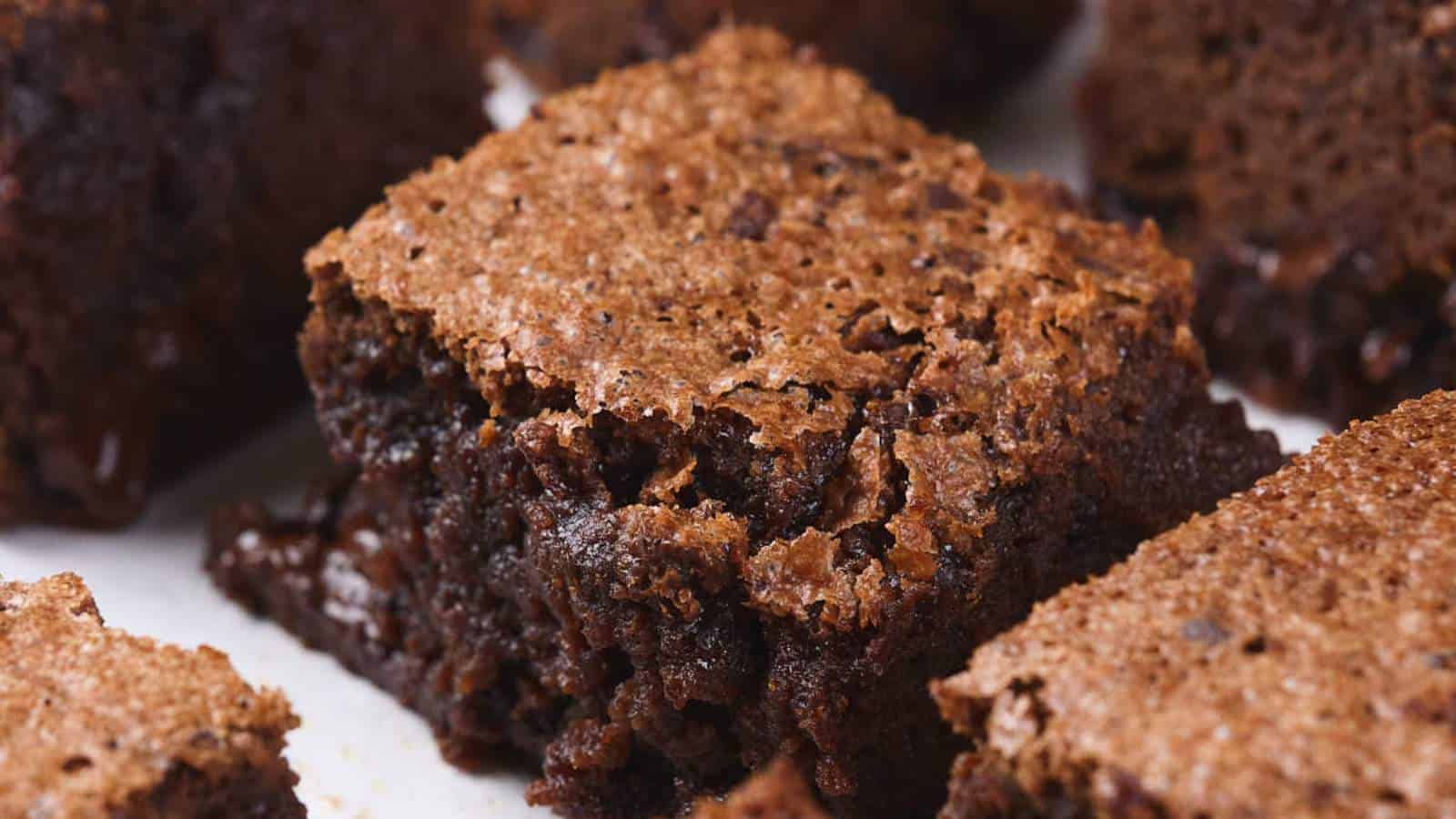 Close-up of a batch of pumpkin brownies with a crispy top and moist interior.