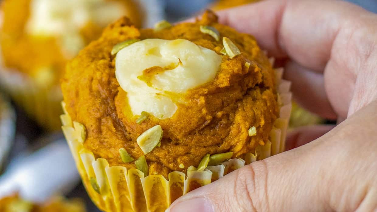 Copycat starbucks pumpkin cream cheese muffin in someones hand.