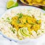 Creamy chicken curry over rice with lime.