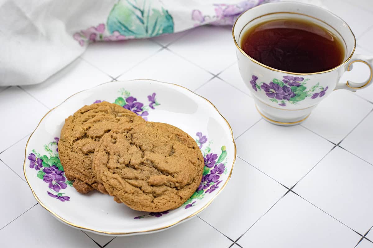 A plate of Spiced Ginger Cookies and a cup of tea.