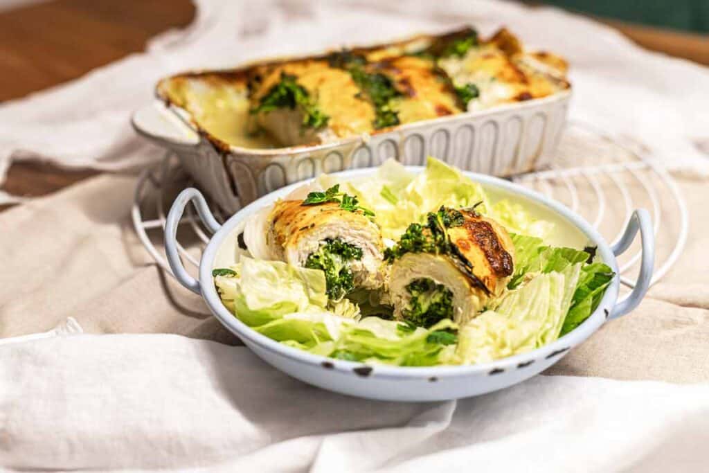 Stuffed chicken casserole served with lettuce.