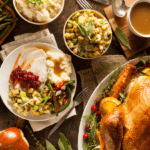 A Thanksgiving meal with roasted turkey, mashed potatoes, stuffing, green beans, cranberry sauce, and gravy is arranged on a wooden table—enjoy the holidays guilt-free.