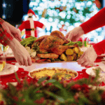 Hands placing a platter of roasted chicken, potatoes, and asparagus on a festive table with a holiday backdrop, inviting you to enjoy the holidays guilt-free.