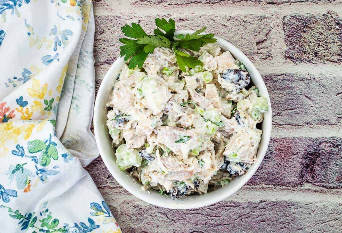 Turkey Salad with Cranberries & Walnuts on a white bowl.